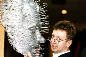 David Mack artist with his sculpture of human face made out of coat hangers