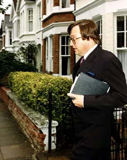 Affair Prints: David Mellor Conservative MP looks worried as he leaves his Putney home