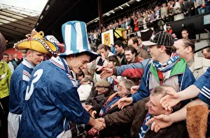 David Robertson Rangers football player with Ian Durrant both wearing hats greet the fans