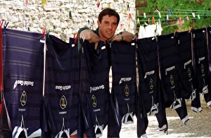 00335 Prints: David Weir posing beside a washing line holding Scotland tops during the World Cup