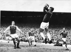 Davies, the Cardiff City goalkeeper gathers the ball as Arsenal