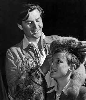 00048 Prints: Davy Crockett (Fess Parker) presents a real Davy Crockett hat to 12 years old Joe Chesney