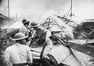 01454 Prints: Last Days at Singapore. Civil defence workers fight the flames