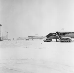 00457 Prints: De-icing operations were in progress when a mobile spryer was used on the tail