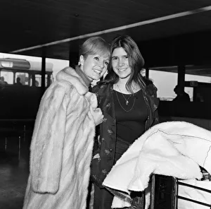 And Child Prints: Debbie Reynolds and her 15-year-old daughter Carrie Fisher at Heathrow Airport today