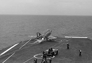 Core01 Prints: The deck crew on board HMS Ark Royal protect their ears as a McDonnell Douglas Phantom