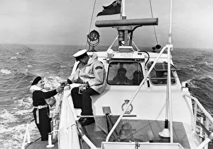 Deck hand Eric Fry (left) and Mechanical Second Coxswain Fred Mullay at work on board