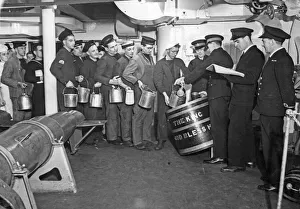 Battleship Prints: Below deck of HMS George V, a line of seamen queue to collect the daily rum ration for