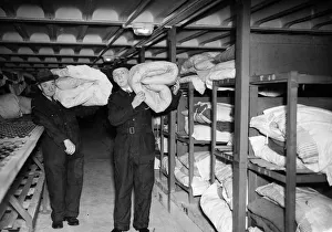 Shelter Prints: Deep shelter wardens transferring bedding in the first shelter to be opened tonight
