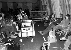 Delayed passengers at Gatwick Airport pass the time in a specially erected 8