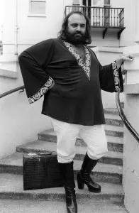 Demis Roussos July 1976 in London `Short Kaftan and white trousers