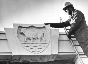 Demolition worker Les Gilbert prepares the Morris rebus for its move to the Museum of