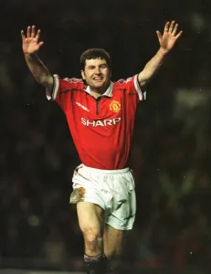 Treble Season Prints: Denis Irwin Manchester United celebrates January 1999 after scoring from the penalty spot