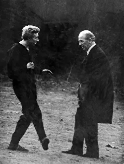 Denis Law of Manchester United talking through the details of an injury with manager Sir