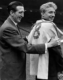 Denis Law meets his new jersey and the Capt of Manchester City team Ken Barnes