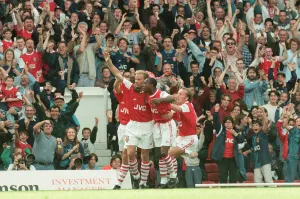 Highbury Prints: Dennis Bergkamp celebrates his first ever goal for his new club Arsenal