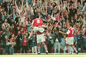 Dennis Bergkamp celebrates his first ever goal for his new club Arsenal