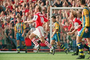 Dennis Bergkamp celebrates his second goal for his new club Arsenal