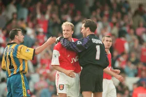 Highbury Prints: Dennis Bergkamp is congratulated by Arsenal goalkeeper David Seaman as they celebrate