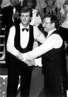 Dennis Taylor comiserates Steve Davis after winning the Embassy Snooker World