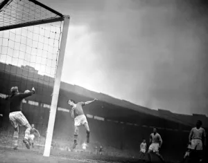 Core61 Prints: Dennis Viollet of Manchester United heads towards goal the Manchester City goal but