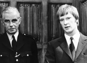 00142 Prints: Dennis Waterman actor on trial for the murder of his father in scene from Metro Goldwyn