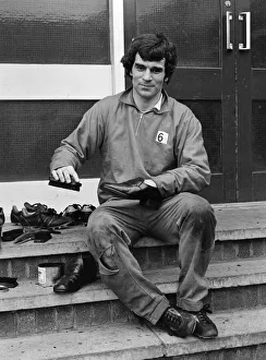 Derby County in training. Henry Newton of Derby County FC cleans his shoes during