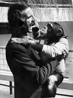 Derek Dougan Wolverhampton Wanderers football player with Monty the chimp at Dudley Zoo