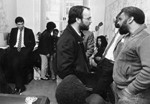 Derek Hatton looks on as he is imprisoned in his council office by members of the Black