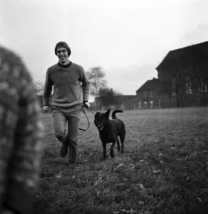 Derek Jeffries takes his dog Blackie for a run in a park near his home in Longsight