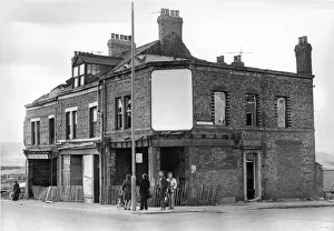 Rubbish Prints: Derelict housing in Askew Road, Gateshead - people standing at a bus stop