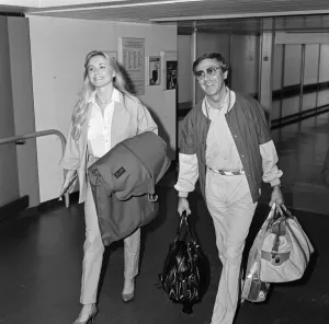 Girlfriend Prints: Des O Connor arriving at Heathrow Airport from Australia with his girlfriend Jay
