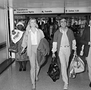 00976 Prints: Des O Connor arriving at Heathrow Airport from Australia with his girlfriend Jay