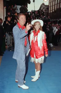 Des O Connor and guest arriving at Elton Johns 50th birthday party