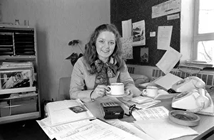 Secretary Prints: A desk covered with paper, empty coffee mugs and a calculator symbols of the busy