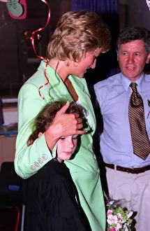 Diana, Princess of Wales with her arm round Danielle Stephenson on avisit to a