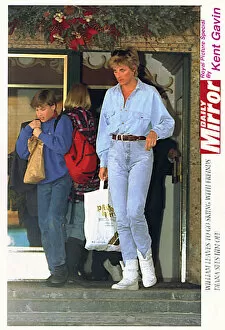 Images Dated 30th March 1994: Diana, Princess of Wales carries a bag for her son Prince William as he leaves