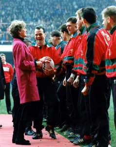 Diana, Princess of Wales is introduced to the Welsh rugby team by captain Ieuan Evans