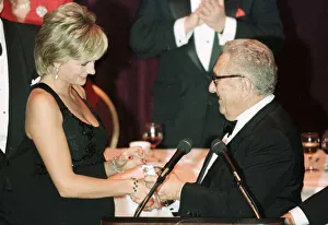 Diana, Princess of Wales receives an award former US Secretary of State Henry Kissinger