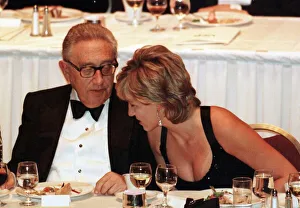 Diana, Princess of Wales with former US Secretary of State Henry Kissinger as she attends
