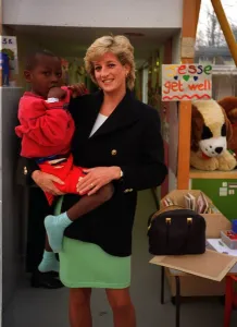 Diana, Princess of Wales, with seven year old Arnaud Wambo from Cameroon