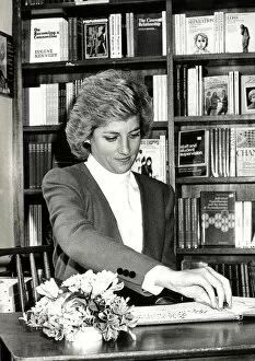 Images Dated 23rd March 1988: Diana, Princess of Wales during a visit to Rugby. She is seen here signing the RELATE