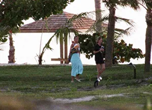 West Indies Prints: Diana, Princess of Wales, walks back to her chalet with her friend Victoria Mendham