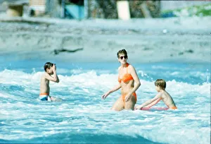 Diana, Princess of Wales in the water with her children Prince William