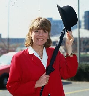 Images Dated 1st April 1984: Diana Rigg actress April 1984 wearing red jacket holding bowler hat and umbrella