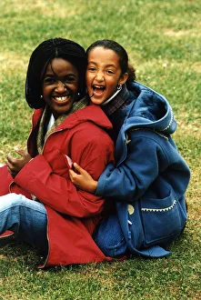 Diane Louise Jordan with young girl her niece Justine wearing blue jacket