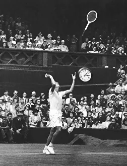 Winner Prints: Dick Savitt throws racket in air after winning the 1951 mens singles final against Ken