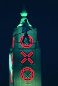 Danger Prints: Didier Pasquette a tightrope walker silhouetted against the Oxo Tower in action above