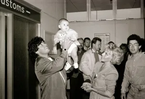 Diego Maradona - Football Player - August 1987 with Baby