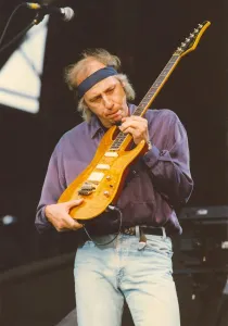 Guitarist Prints: Dire Straits frontman Mark Knopfler performs with the group at Gateshead